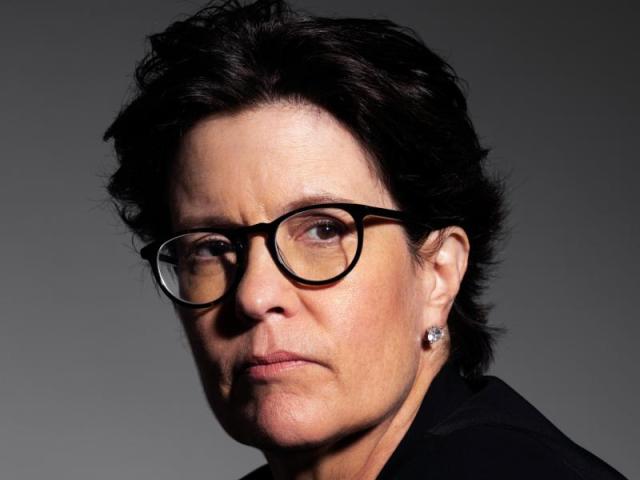 Headshot of Kara Swisher wearing black glasses.